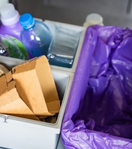 Household bins for waste sorting in the kitchen for recycle. Plastic, paper, bio and mixed waste. Sorting waste at home concept
